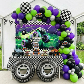 Froufing racing-themed backdrop adds depth to photo-worthy celebrations.