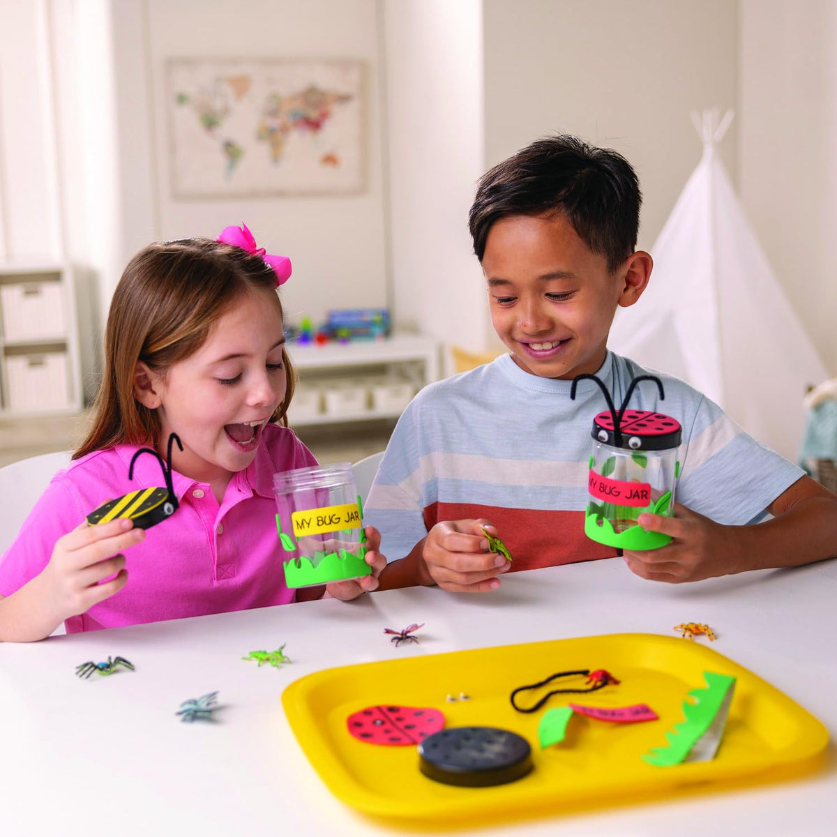 Kids craft with ease, turning a simple jar into a colorful insect showcase.
