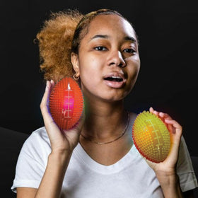 Close-up of the textured rubber surface on Fun Express light-up mini footballs