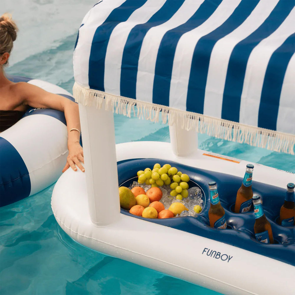FunBoy fabric shade fringe cabana adds shade and festive flair to outdoor gatherings.