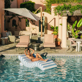 FUNBOY chaise lounger built-in cup holder keeps drinks close while relaxing.