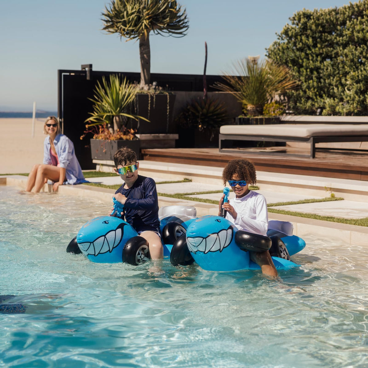 Kid-friendly pool party setup featuring the Sharkruiser design.