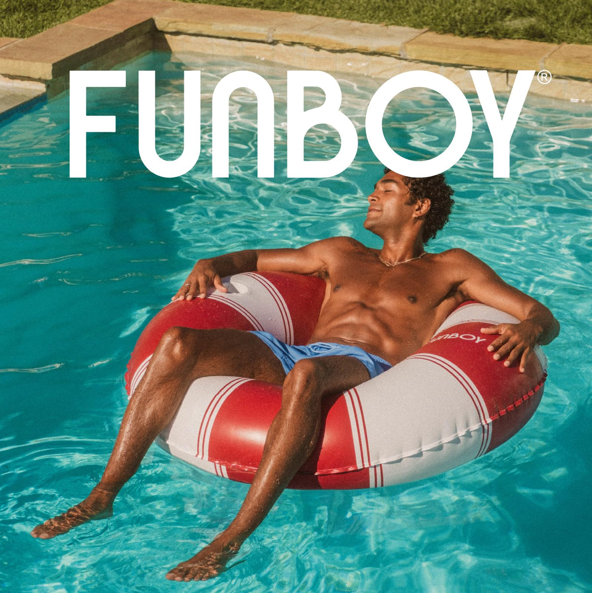 FUNBOY red stripe lounger creates a stylish poolside vibe