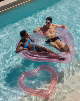 FUNBOY Summer pool party scene highlights versatile float for guests and lounging.