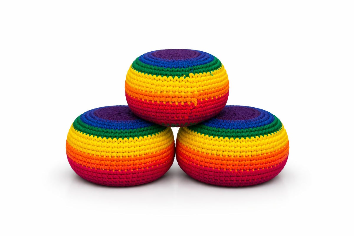 Funny Guy Mugs footbag ball balanced for kicks and catching during travel or festivals.