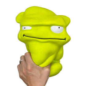 Funnysquee green monster squishy closeup, soft texture and plush feel.