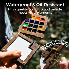 Funto metal clip attaches palette to journal for hands-free painting.