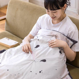 Furvana Manta Ray wearable blanket wrap for cozy lounging.