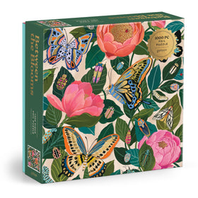 Galison Between the Blooms puzzle cover shows butterflies and blossoms for calming assembly.
