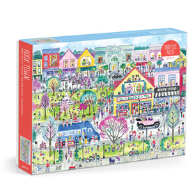 Galison Book Townscape puzzle showing cozy bookstores along a sunny street, inviting puzzling sessions
