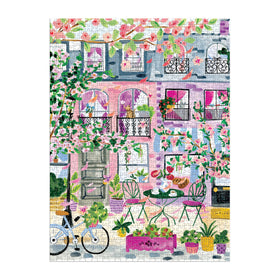 Galison Cherry Lane Blossoms street scene brings a serene spring mood to your puzzle session.
