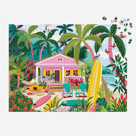 Galison Surfside Bungalow beach scene captures soft sand and azure water for coastal ambiance.