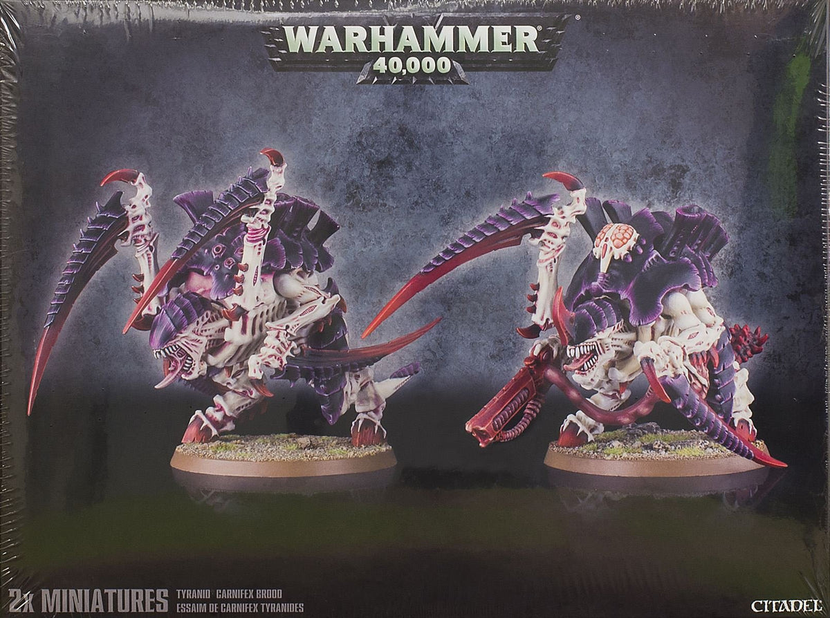 Games Workshop Carnifex Brood being assembled for dynamic tabletop poses.