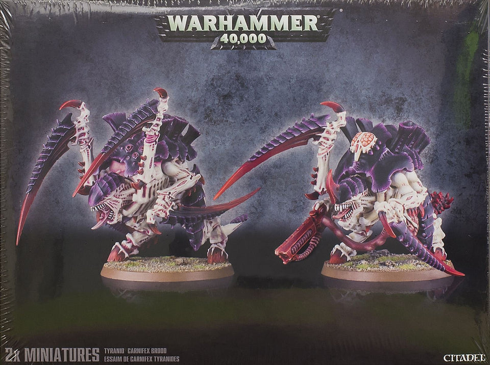 Games Workshop Carnifex Brood being assembled for dynamic tabletop poses.