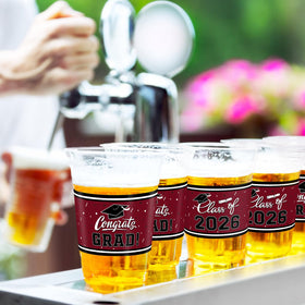 Gatherfun 100-count graduation cups pack view, reliable plastic for celebrations.