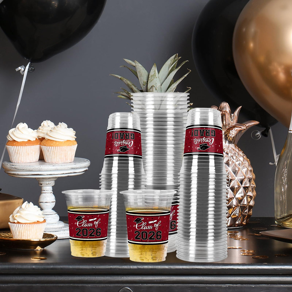 Gatherfun graduation cups with hats and scrolls, close-up of celebration design.