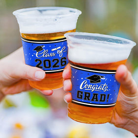 Gatherfun hats-scrolls-design cups enhance graduation table decor and cohesion.
