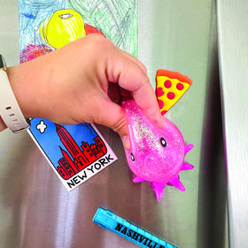 GEDDES Raymond octopus suction toy pink on fridge showing easy surface attachment during play
