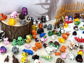 Generic 150pc 3D printed animal figurines arranged for desk or shelf display.