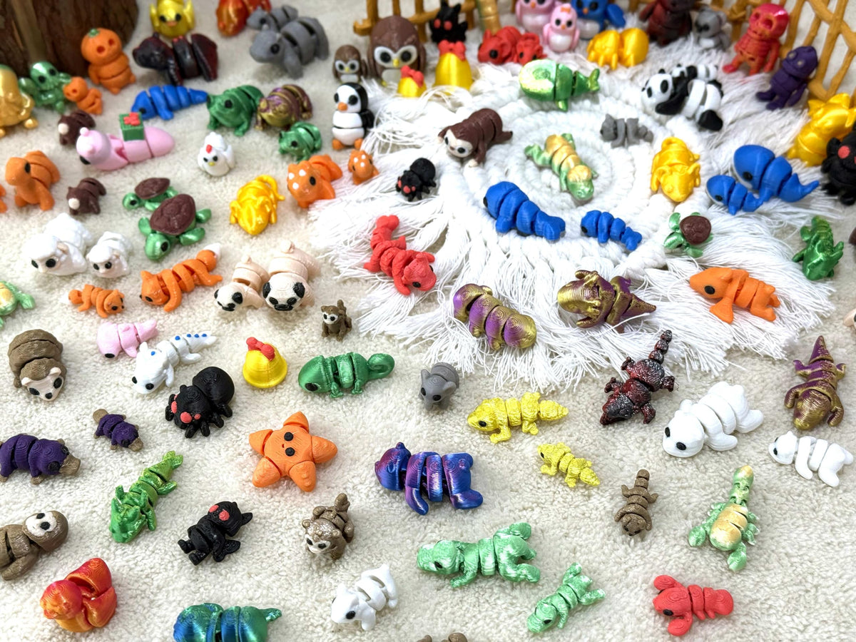 Generic 150pc 3D printed animal figurines in compact packaging for gifting.