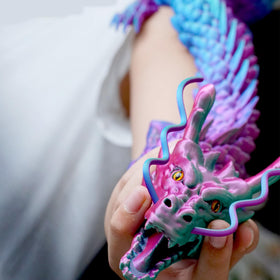 Generic 3D printed dragon model shows intricate details with a glossy finish