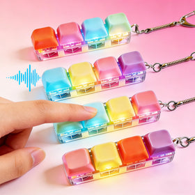 Generic LED glow close-up shows tactile click on the fidget keyboard keychain.