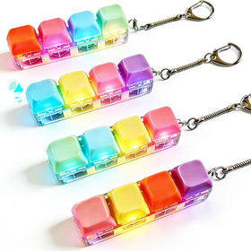 Generic 4-pack fidget keyboard keychain in pink offers portable stress relief on the go.