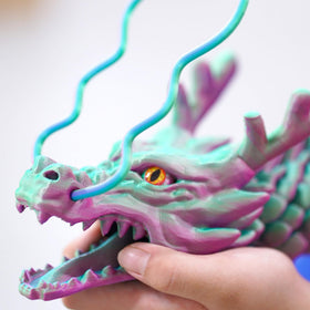 Generic dragon being held or wrapped around hand for scale