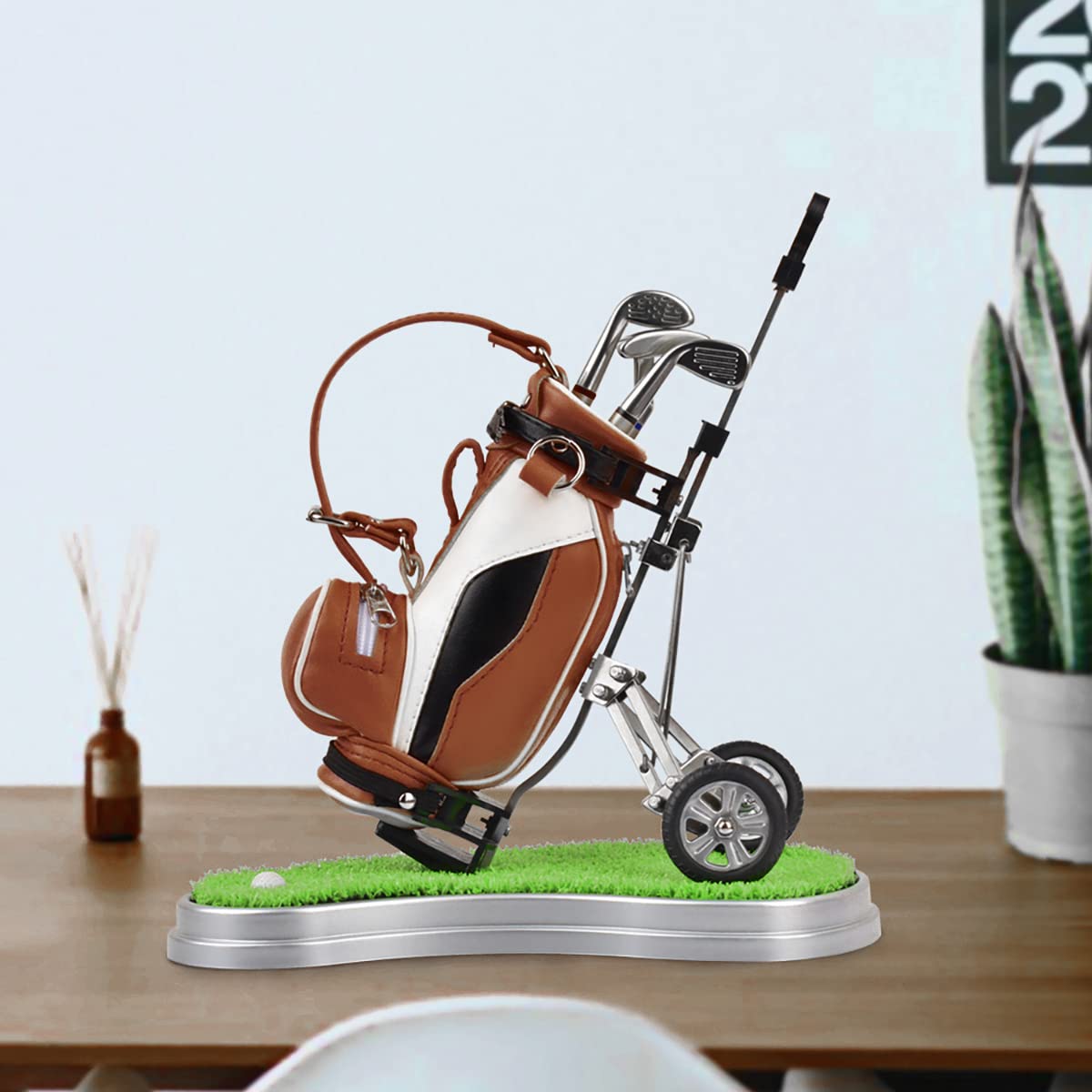 Generic dual-purpose golf pen holder mini golf bag included on display.