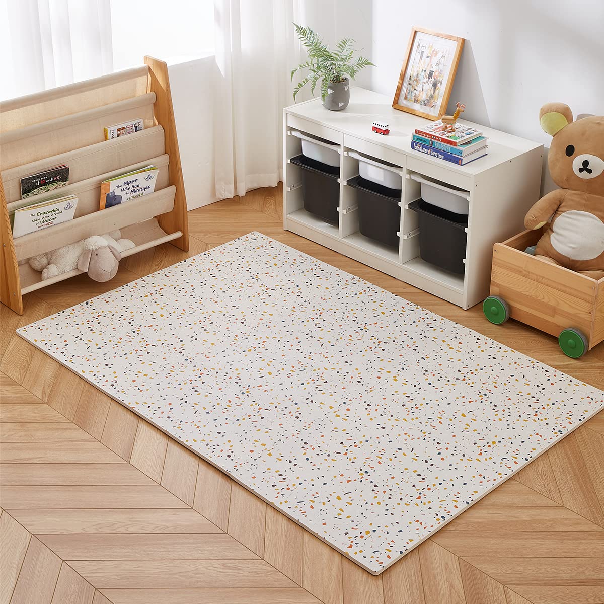 Generic terrazzo multi design enhances modern nursery aesthetics during play.
