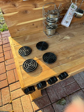 Generic raised burner design helps water drain away from wood