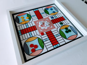 Generic Snakes and Ladders on glass top for quick luck-based fun