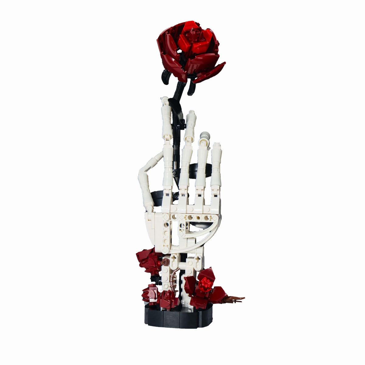 Generic RITTSUN skull rose building set features a bone-white hand and red rose for Gothic desk decor.