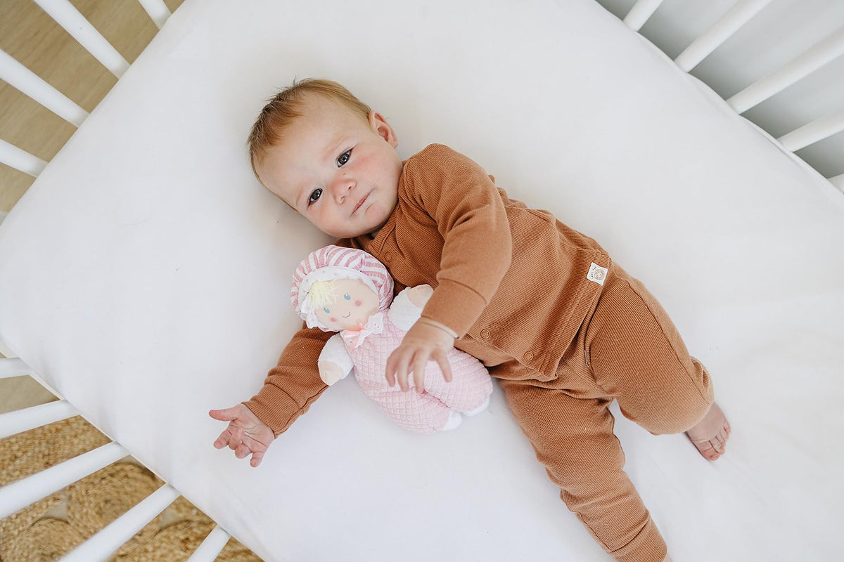 Genius Baby Toys dolly hug and cuddles showcases comforting presence during bedtime routines.