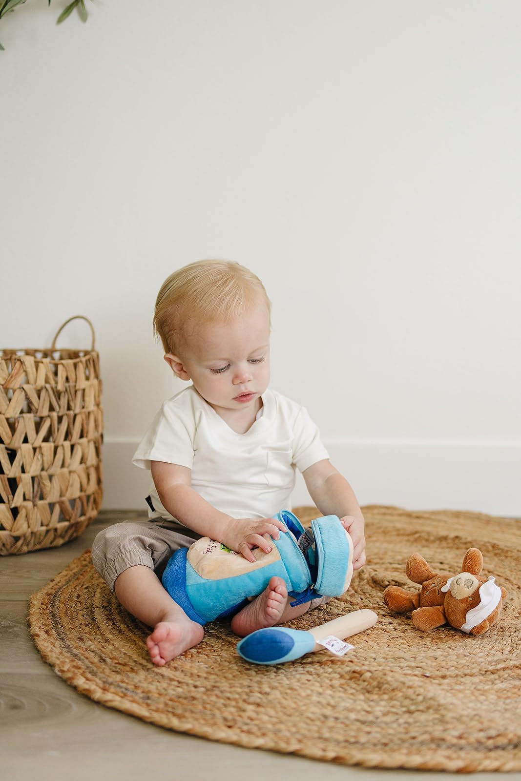 Genius Baby Toys Golf Tee encourages stacking and small-finger practice.