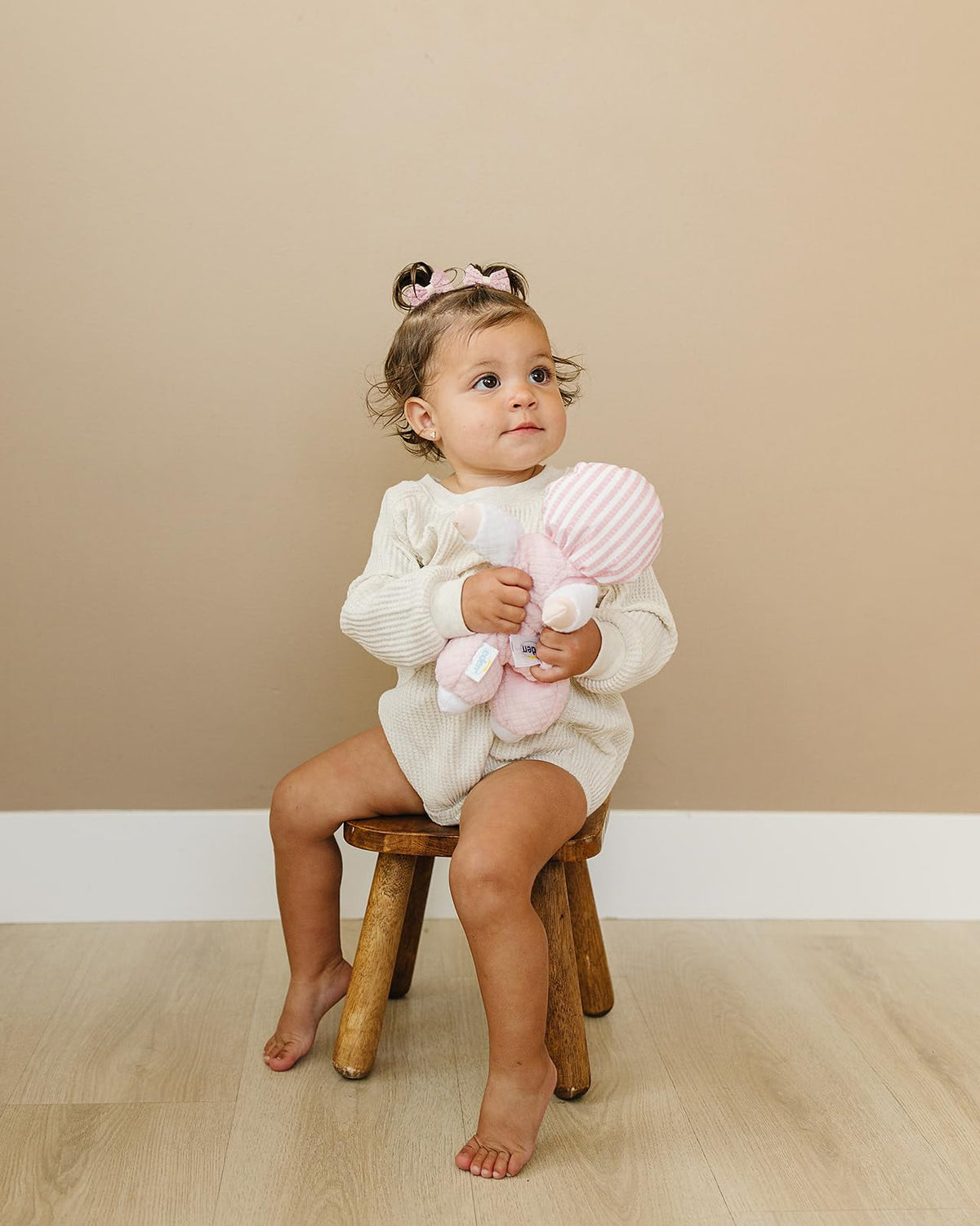 Genius Baby Toys soft plush terrycloth doll offers gentle texture for sensory exploration.