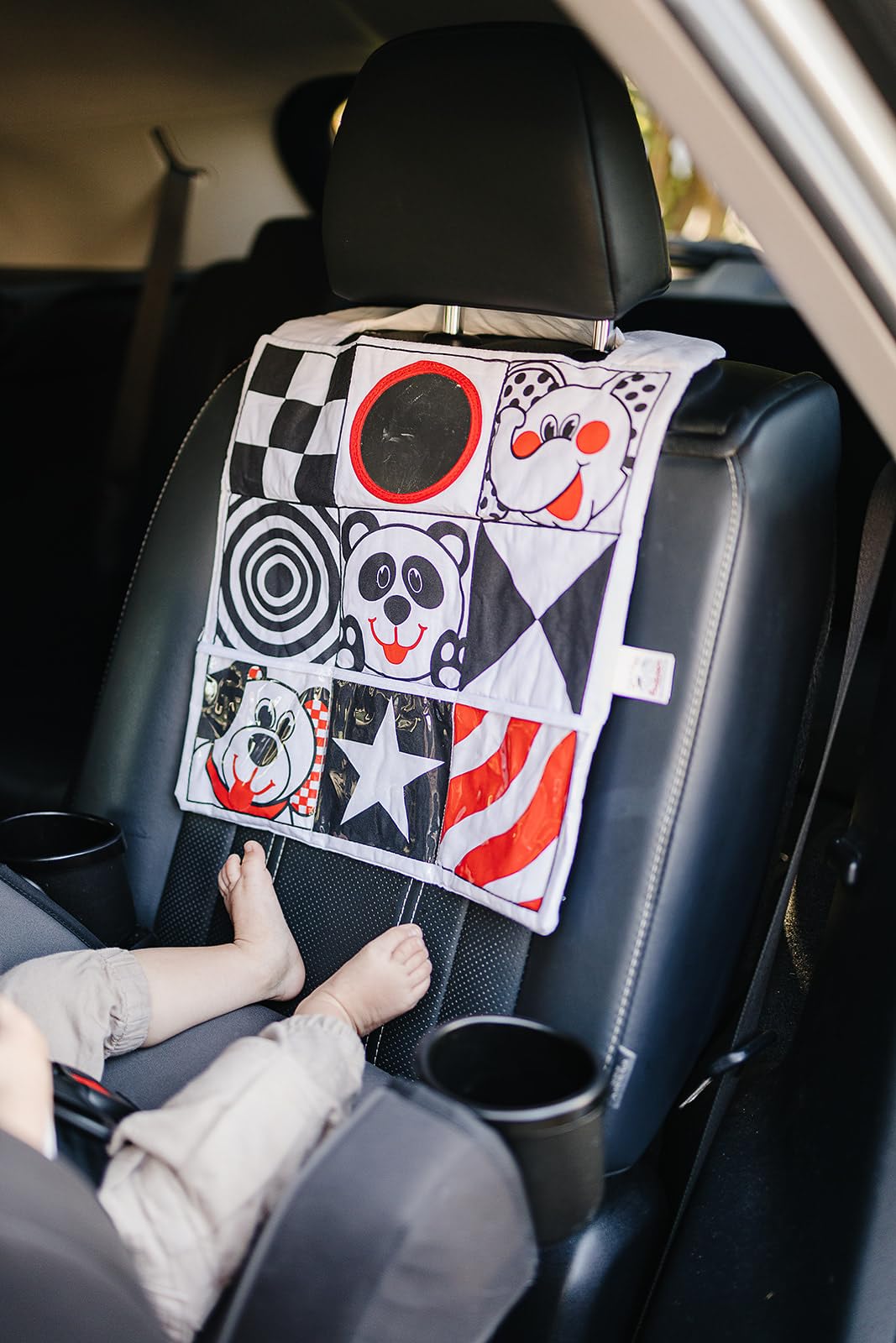Genius Baby Toys vinyl pockets provide convenient storage for small items on the go.