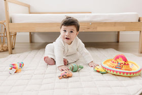 Genius Baby Toys yellow taco face toy offers rattle for motor practice
