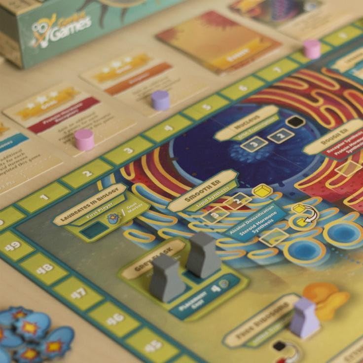 Genius Games Cytosis: players in action on a busy game board exploring organelles.