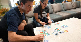 Genius Games Peptide mRNA nucleotide tiles shown during drafting rounds.