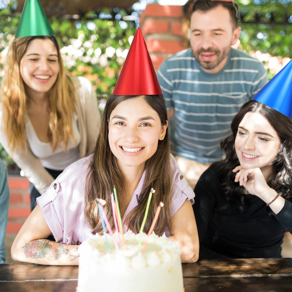 Geosar bulk hats in party scene, easy coordination for large gatherings.