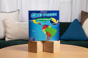 GeoToys GeoPuzzle pieces spread across a table for classroom-style geography exploration.