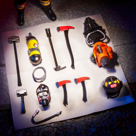 Firefighter figure with axes ready for dynamic posing