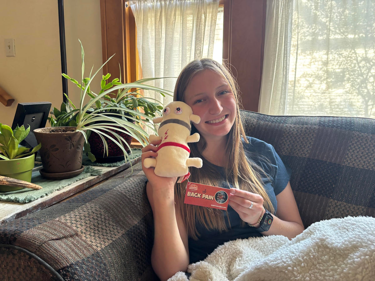GIANT MICROBES Back Pain Plush offers emotional support for patients and caregivers.