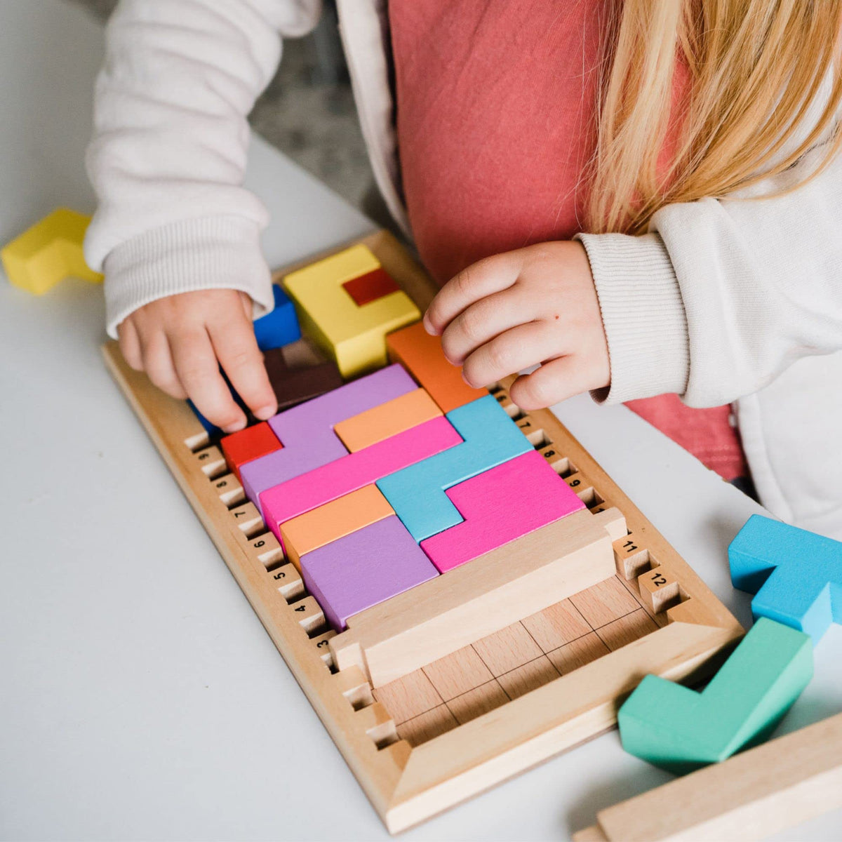 Gigamic Katamino Family pentomino pieces in bright colors aid pattern recognition.