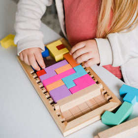 Gigamic Katamino Family pentomino pieces in bright colors aid pattern recognition.