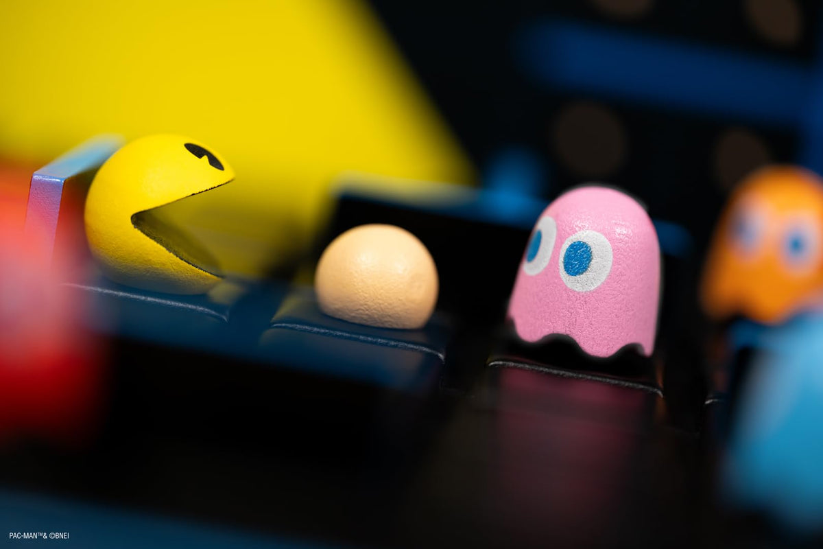 Iconic Pac-Man artwork enhances retro table-top gaming vibe.