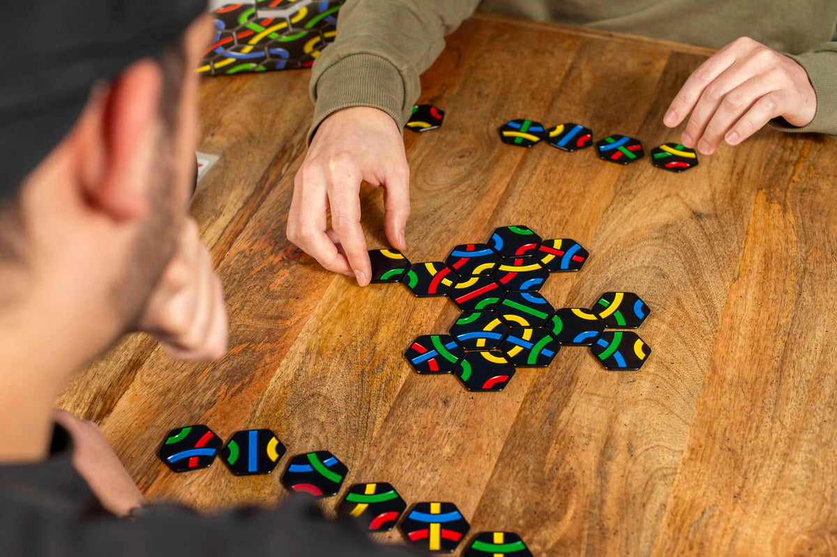 Gigamic Tantrix Strategy compact box and resin tiles with rules visible.