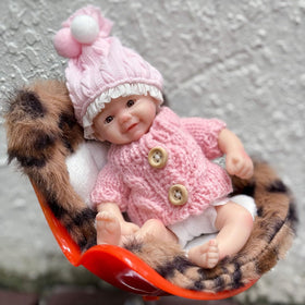 Gileutay palm-sized doll in kids' hands demonstrates compact, portable fun.
