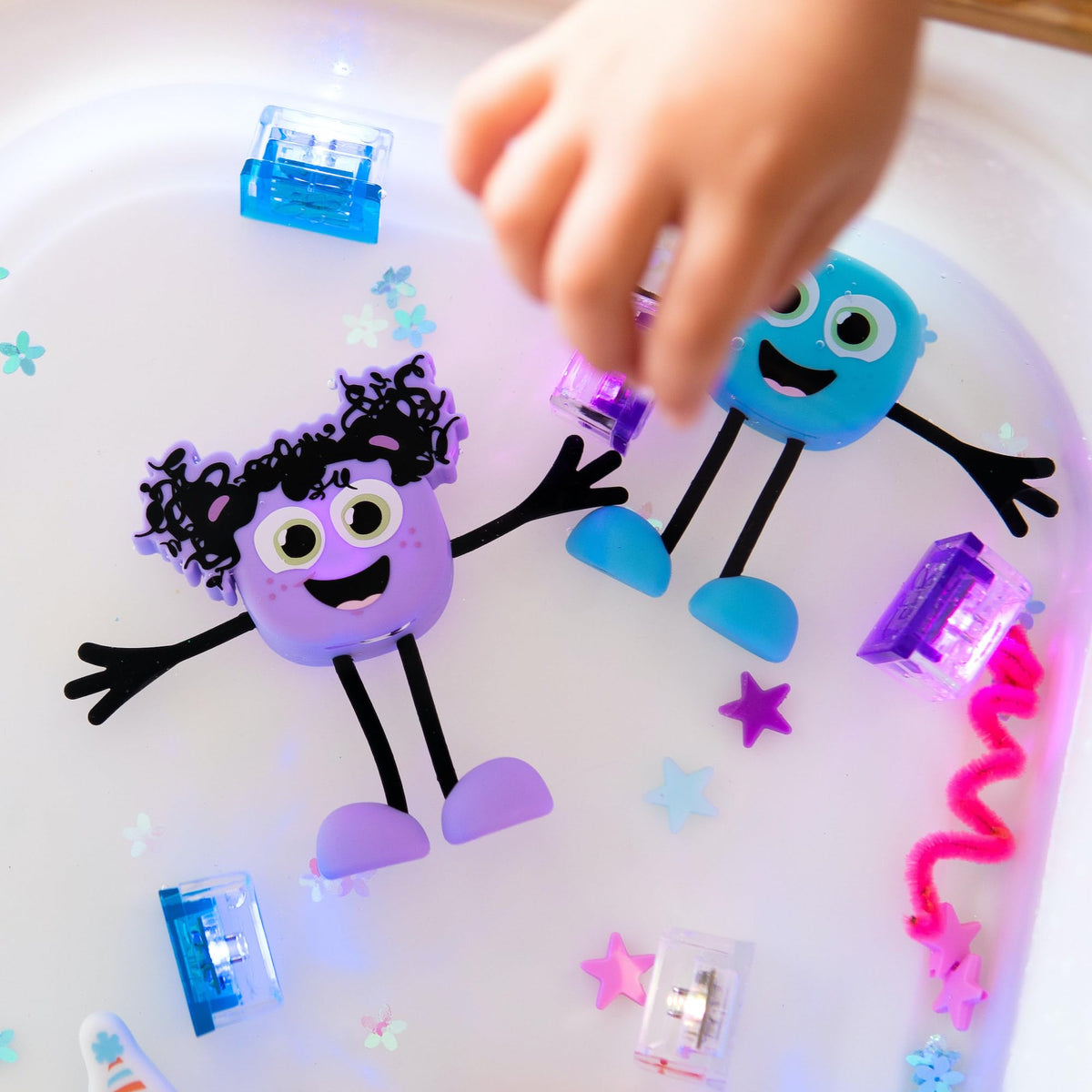 Glo Pals cubes encourage short, interactive bath play and easy cleanup